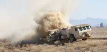 en hydrema minerydder søker etter miner i området rundt et gammelt organisk vannrenseanlegg ved kandahar flyplassa mineclearer vehicle seeks for mines in areas around kandahar airport in afghanistan